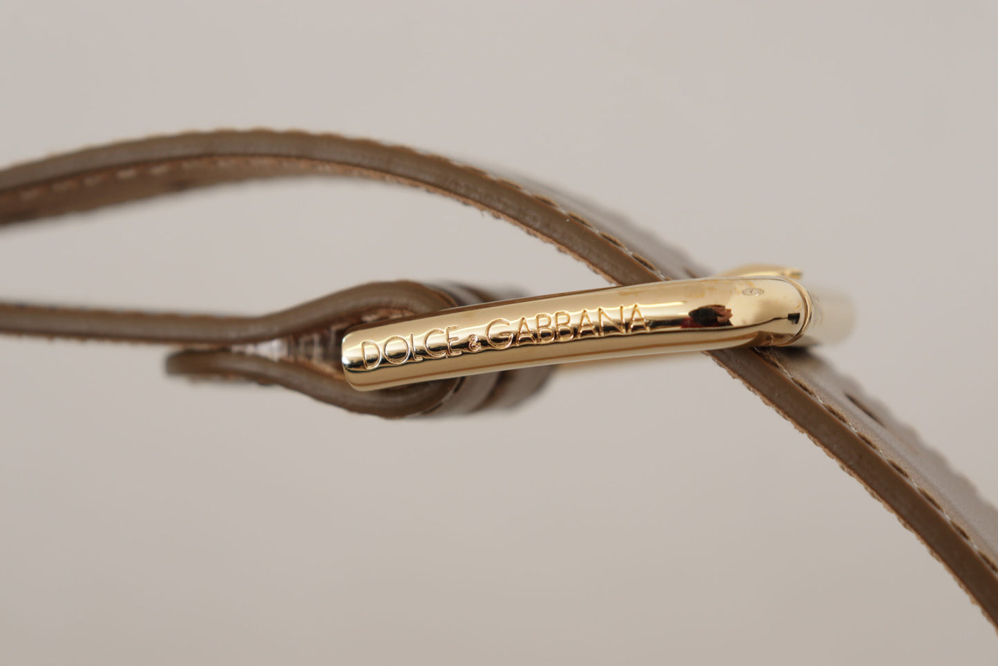 Dolce &amp; Gabbana Ceinture à boucle en cuir bronze avec logo doré gravé