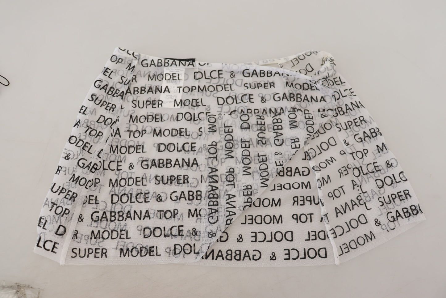 Dolce &amp; Gabbana Mini-jupe trapèze transparente avec logo blanc