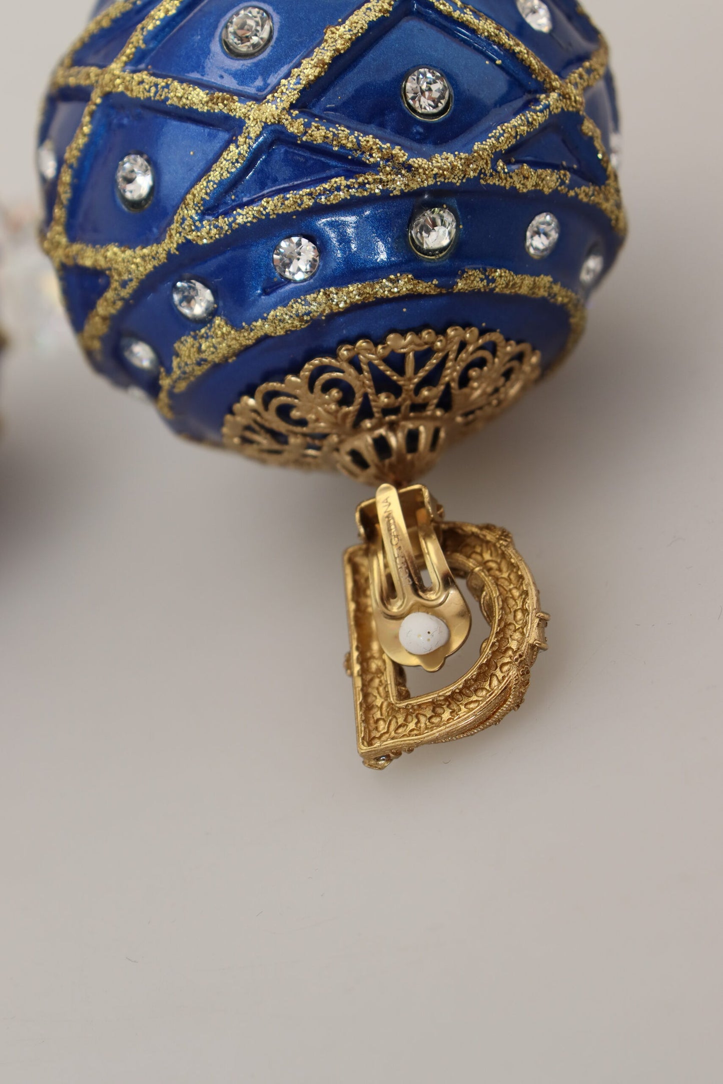 Dolce &amp; Gabbana Boucles d'oreilles à clip avec boule en laiton doré et cristal bleu