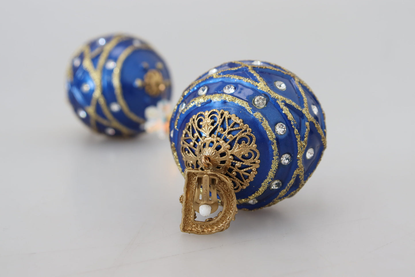 Dolce &amp; Gabbana Boucles d'oreilles à clip avec boule en laiton doré et cristal bleu