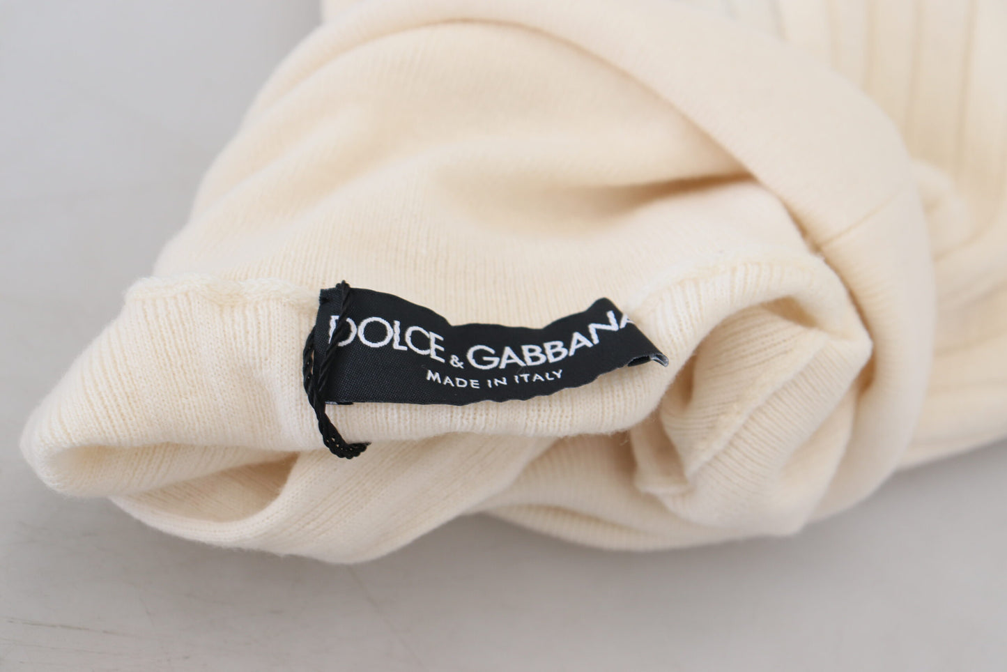 Dolce &amp; Gabbana Elfenbeinfarbener Rollkragenpullover mit Distressed-Manschette