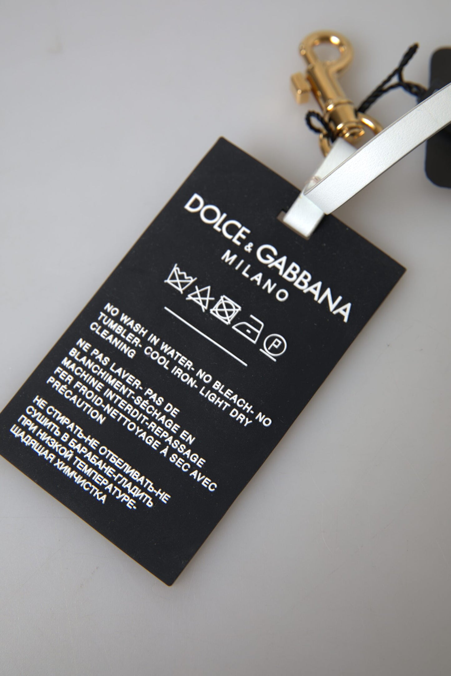 Dolce &amp; Gabbana Schlüsselanhänger aus schwarzem Silikon mit DG-Logo und goldfarbenem Messing